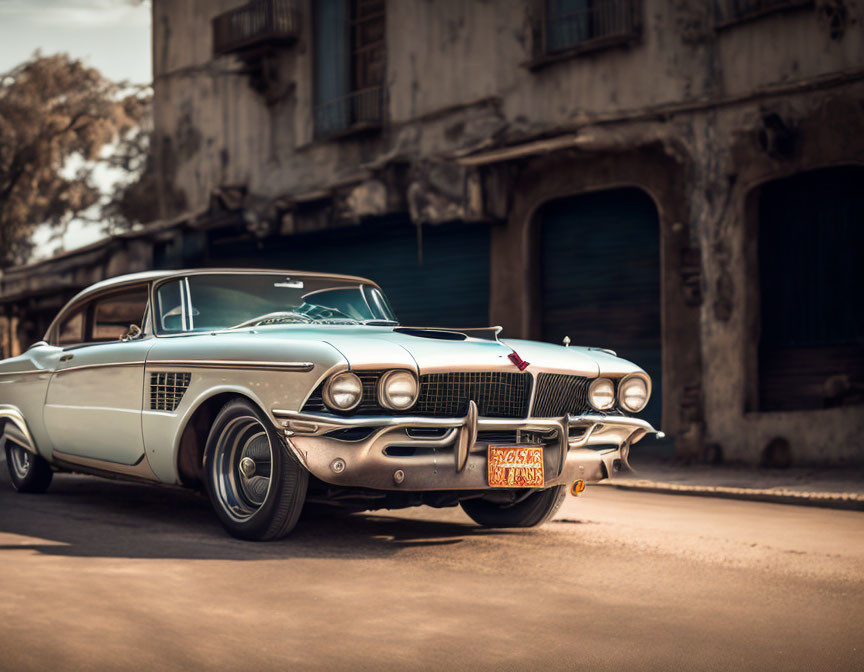 Classic Vintage Car with Chrome Detailing Parked on Street with Aged Buildings