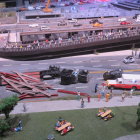 Miniature traffic accident diorama with emergency responders.