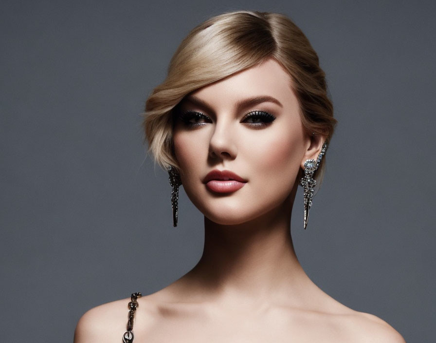 Blonde woman portrait with elegant makeup and earrings