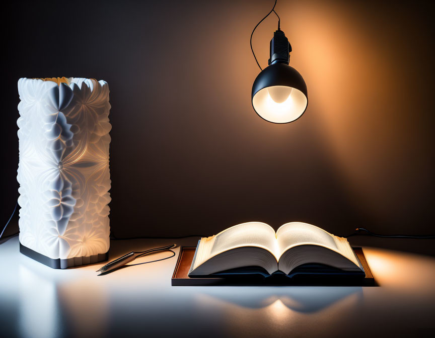 Sculpted table lamp beside open book, reading glasses on desk