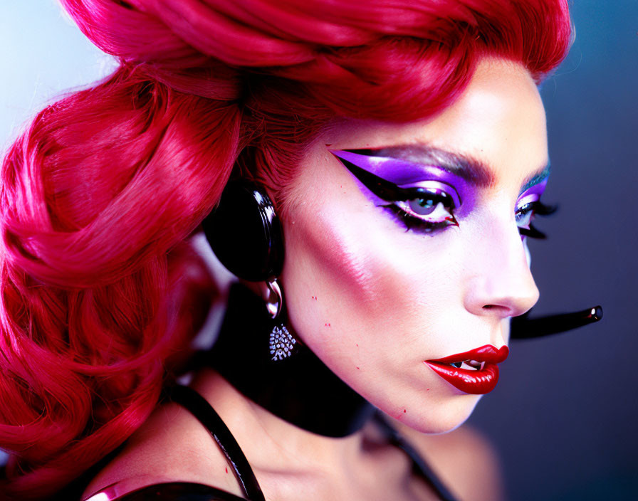 Colorful portrait featuring person with red hair, purple makeup, earring, and red lips on purple