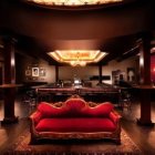 Luxurious Bar with Red Sofa, Golden Accents, Circular Lights, Drapery in Black &