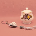 Intricate golden jewelry and ornamental containers on pink satin fabric