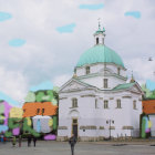 White cathedral with blue domes and sculpted trees under sunny sky