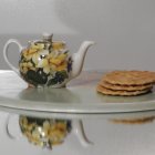 Porcelain Tea Set with Floral Design and Gold Trim on Table