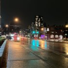 Colorful neon-lit city street at night with bustling pedestrians and traffic