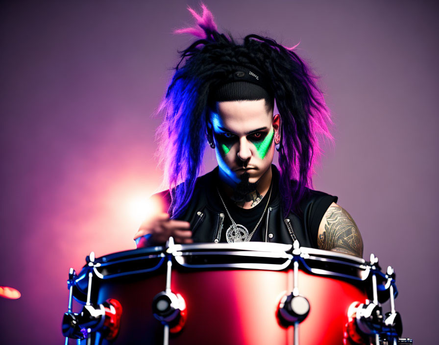 Person with Black and Purple Hair Playing Drums in Dramatic Lighting