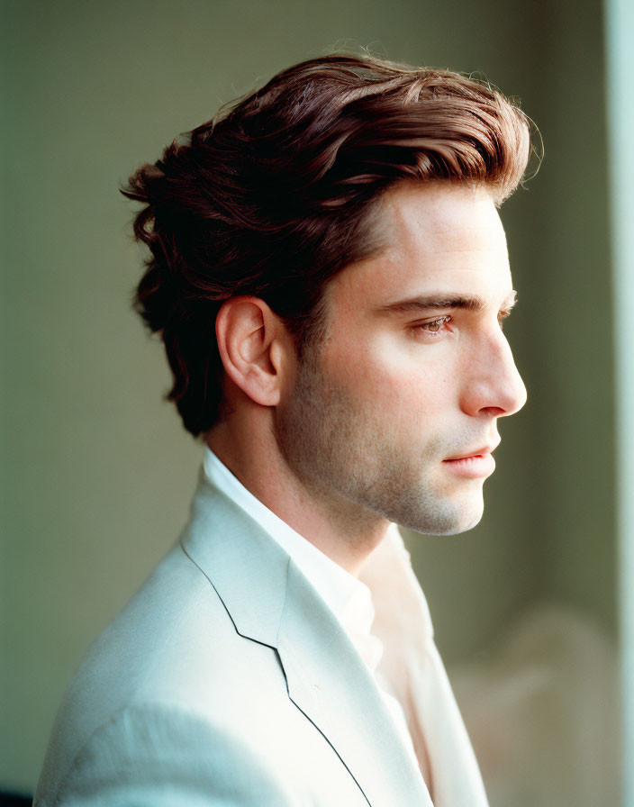 Man in Light-Colored Suit with Styled Hair in Side Profile Pose