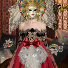 Person in Gold and Red Mask with Crown and Feathered Collar, Surrounded by Lanterns and