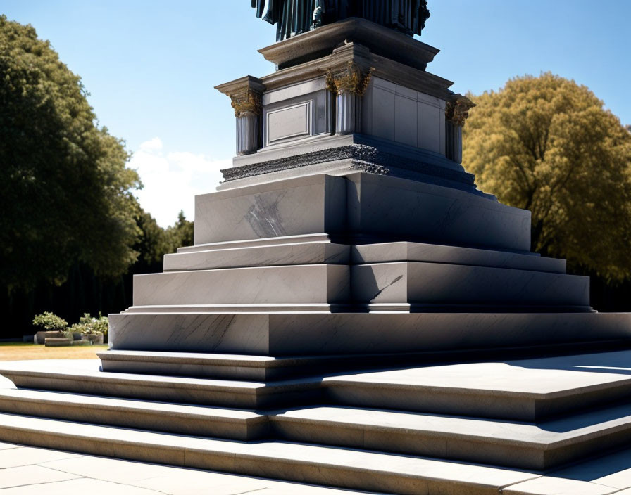 Tiered Monument Statue Bathed in Sunlight Among Trees