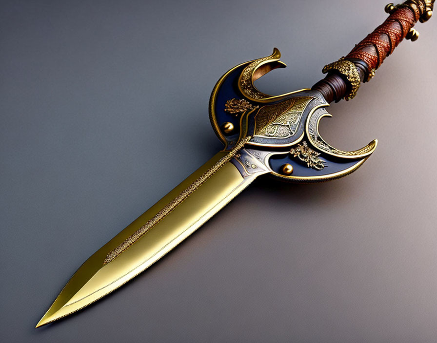 Golden ornate dagger with embellished hilt on grey background