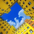 Courtyard with High Yellow Walls and Clear Blue Sky