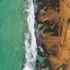 Vibrant Coastal Fields with Beach and Waves