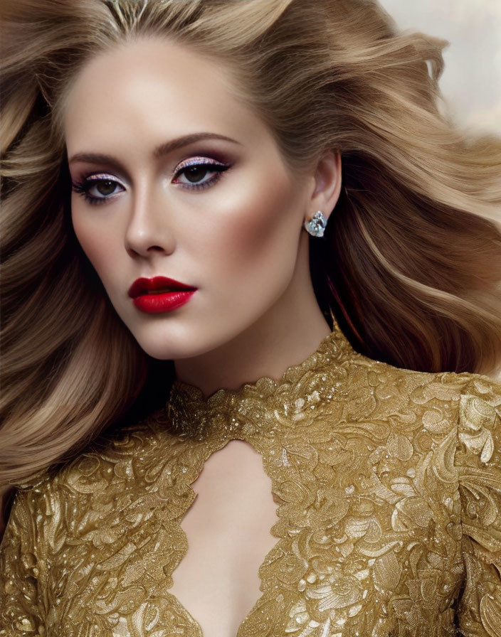 Blonde woman in golden lace dress with red lipstick and smokey eye makeup