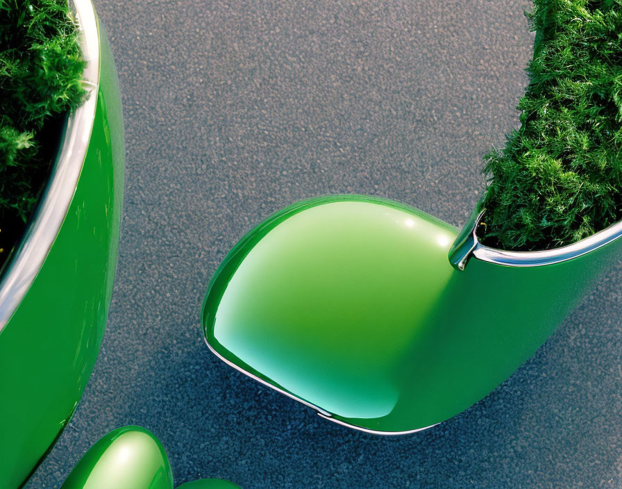 Green modern chair and planters on textured gray surface