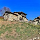 Rustic Stone and Wood Chalets on Lush Hillside