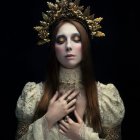 Woman in elaborate attire with rose crown holding a rose on black background