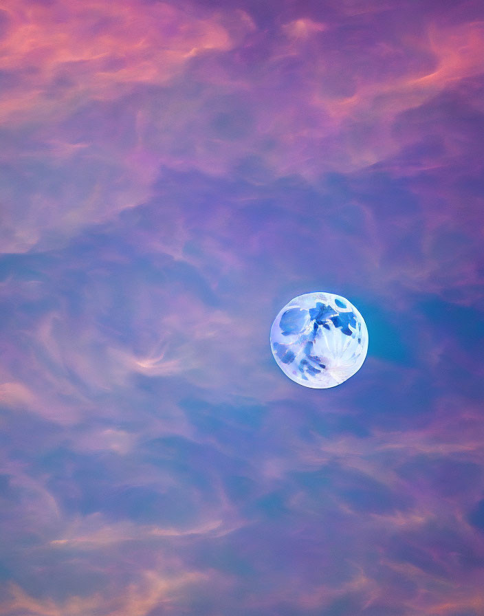 Full Moon in Pastel-Colored Sky with Wispy Clouds