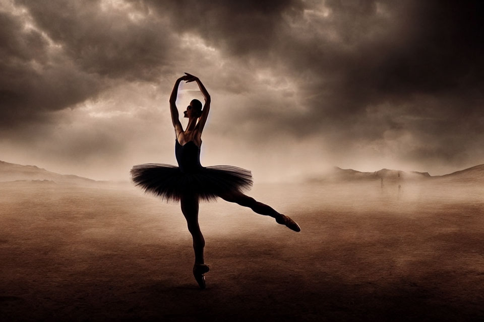 Silhouetted ballerina in black tutu against dramatic sky