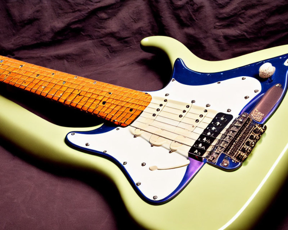 Mint Green Electric Guitar with White Pickguard on Maple Fretboard