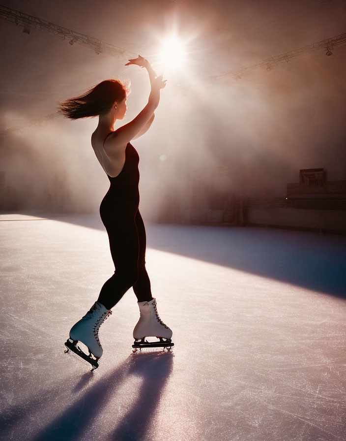 Silhouetted figure skater on ice under glowing sun in misty air