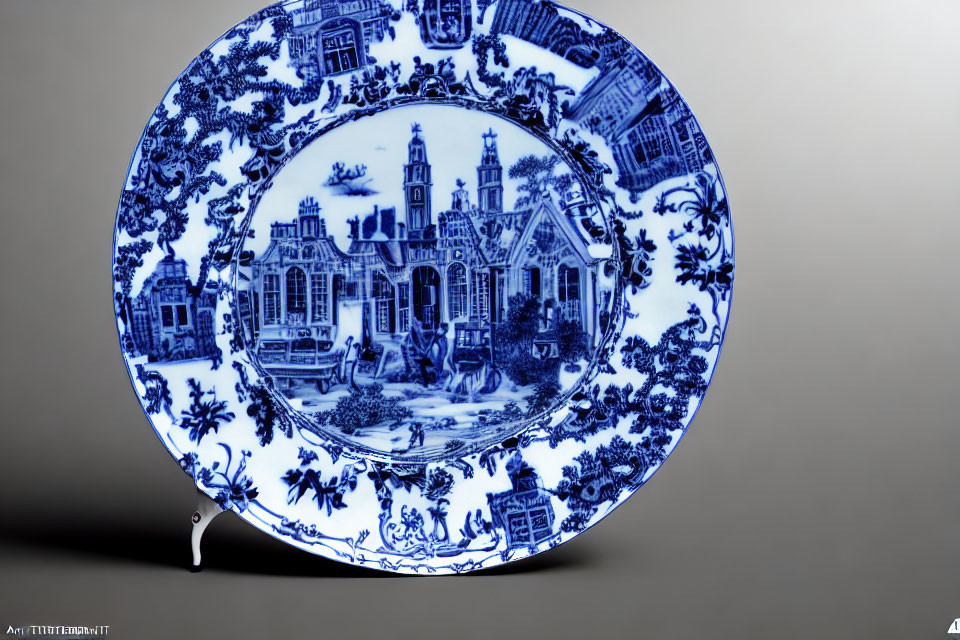 Traditional Blue and White Porcelain Plate with Intricate Architectural and Floral Patterns