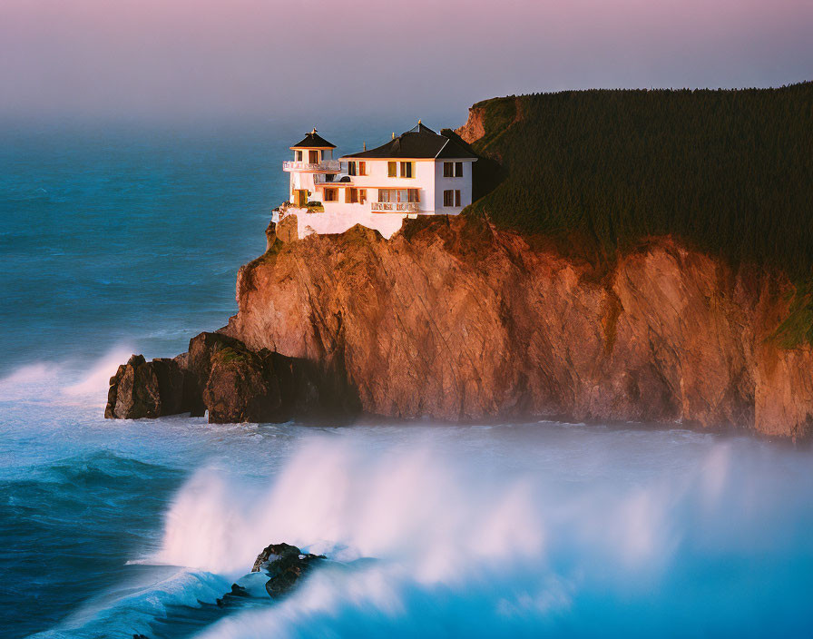 White House with Red Roof on Cliff Overlooking Ocean at Sunrise or Sunset