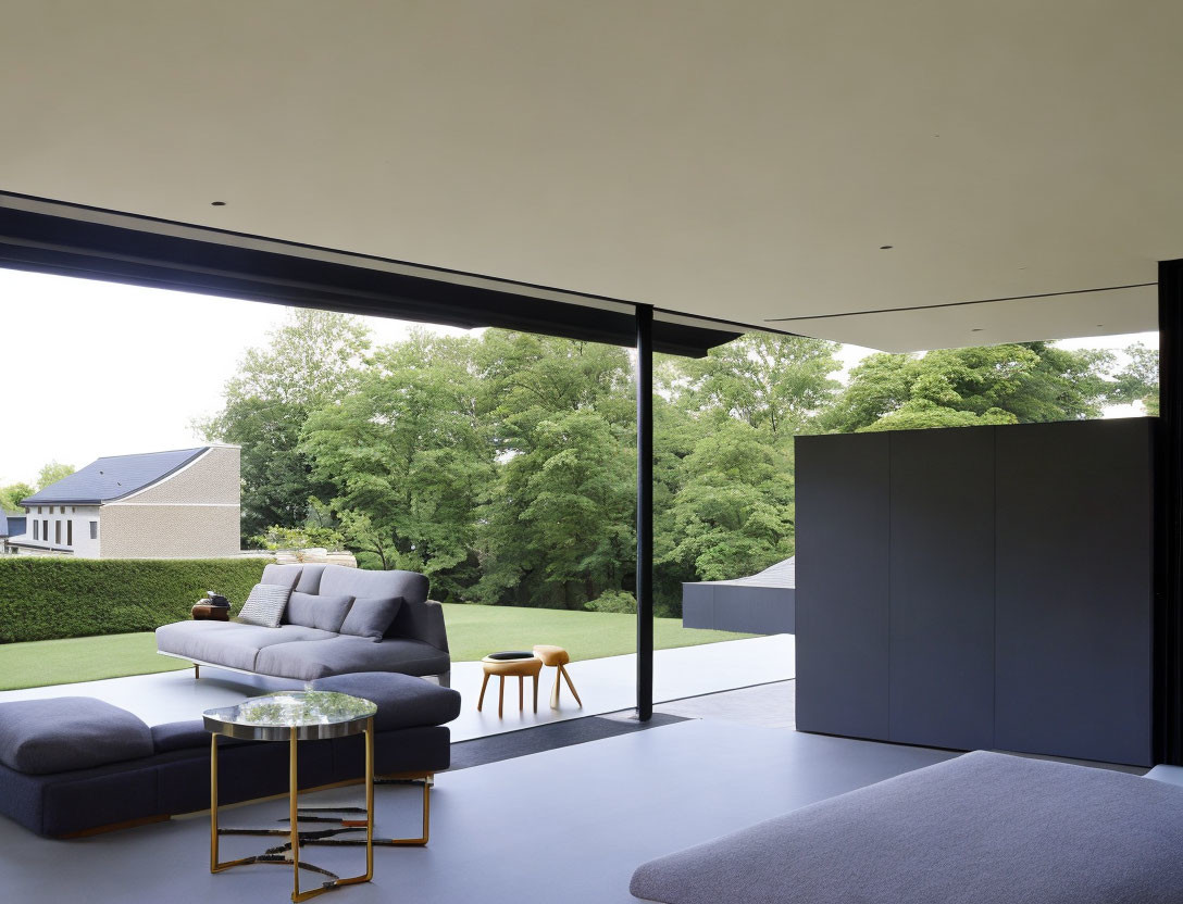 Spacious living room with minimalist decor and expansive windows