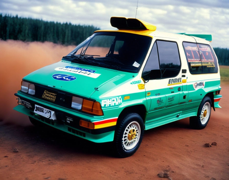 Blue and Green Livery Rally Car on Dirt Track with Sponsor Logos