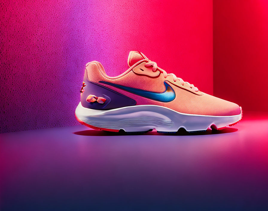 Pink and Blue Nike Sneaker on Red and Purple Gradient Background