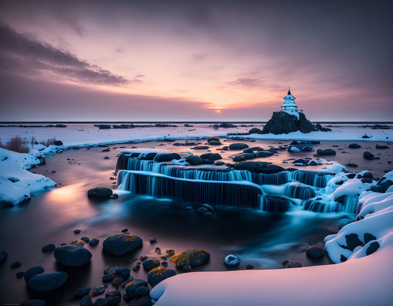 Snowy Landscape with Waterfall and Church at Sunset