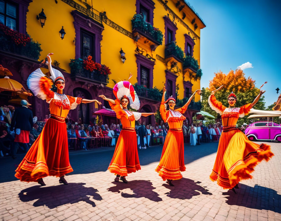 Vibrant orange traditional dancers in colonial setting