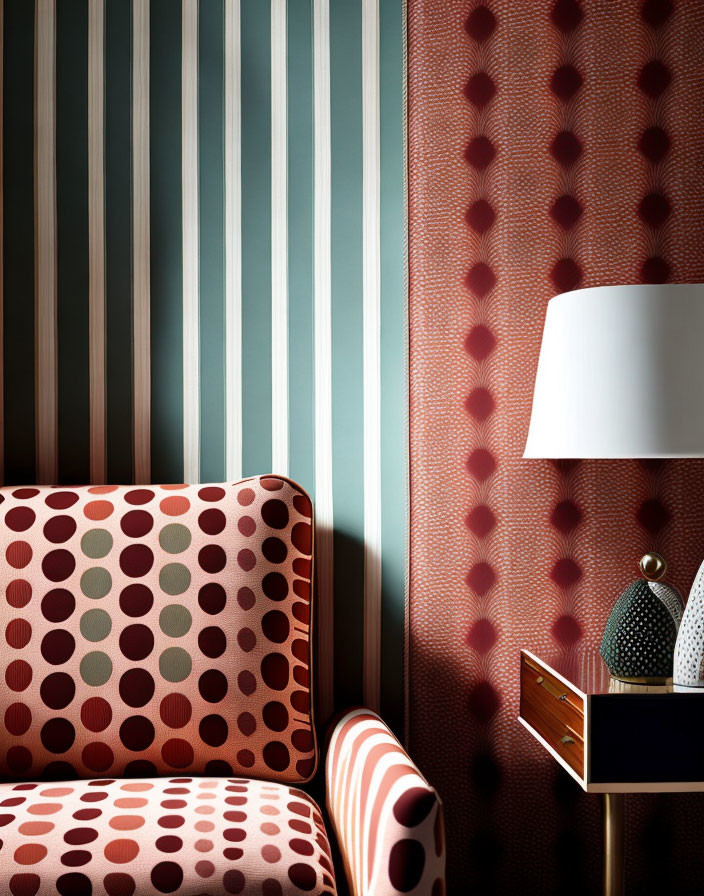 Interior scene with polka-dotted armchair, vertical stripes wall, side table, lamp, and