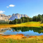 Scenic mountain landscape with autumn trees and reflective lake