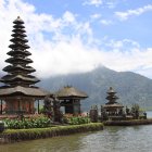 Asian Pagodas Surrounded by Gardens, Lake, and Foggy Mountains