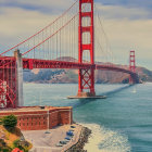 Iconic Golden Gate Bridge on a sunny day with blue skies and rocky shores