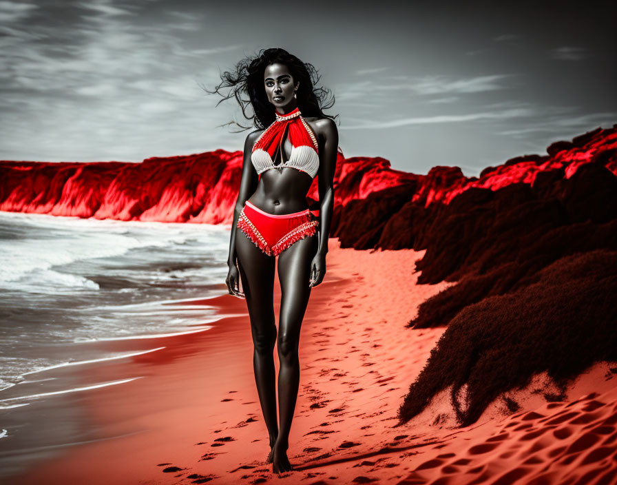 Monochrome beach photo of woman in bikini with red accents