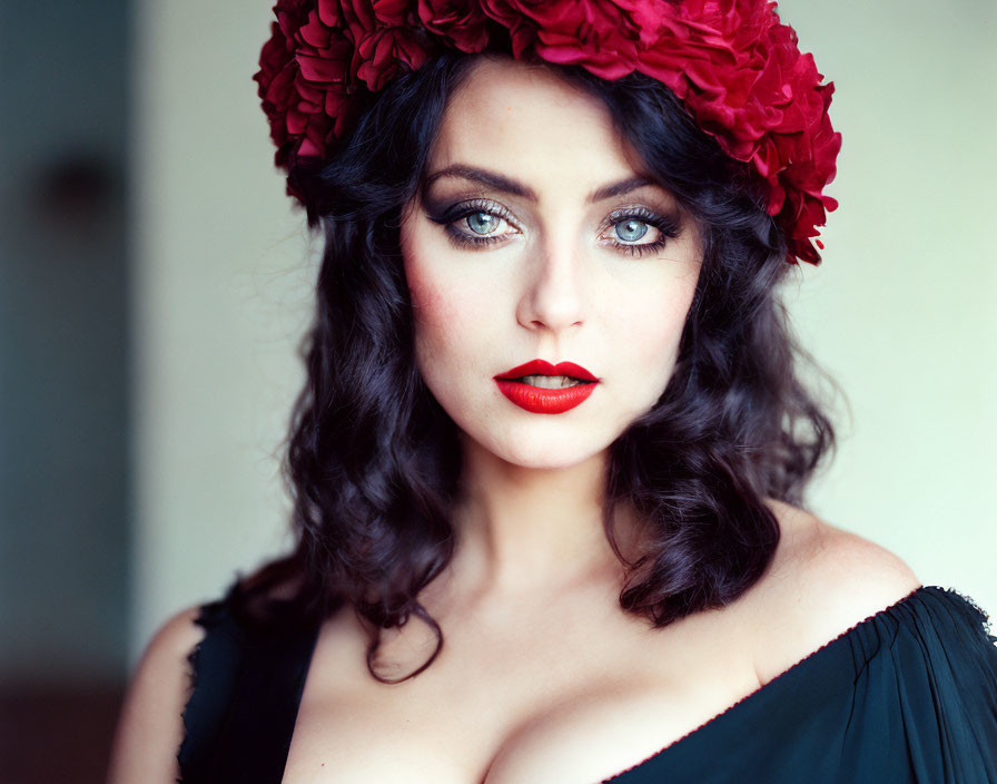 Dark Curly-Haired Woman in Red Floral Headpiece and Black Top gazes at Camera