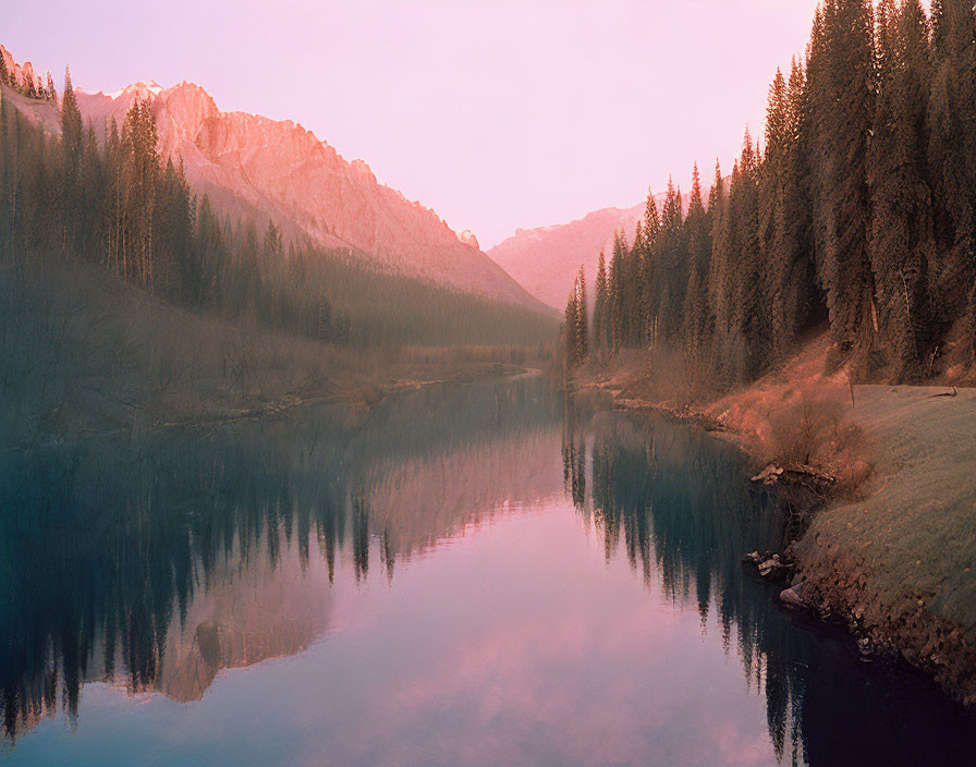 Scenic Mountain Lake at Dusk with Pink Sky Reflections