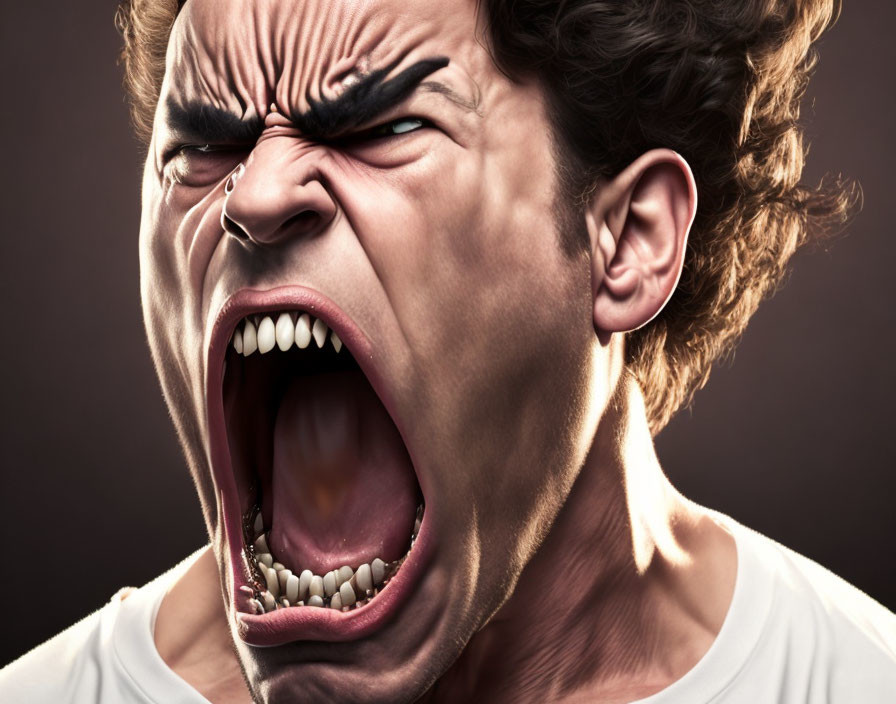 Exaggerated angry facial expression on person in white T-shirt