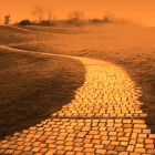 Barren desert landscape with winding cobblestone path