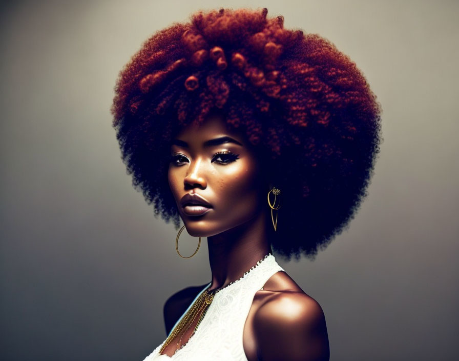 Portrait of woman with voluminous curly afro and striking makeup.