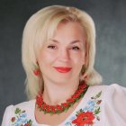 Blonde Woman in Traditional Attire with Gold Jewelry on Starry Background