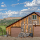 Detailed Illustration of Rustic House with Mountain Backdrop