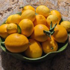 Ripe Lemons Bowl with Purple Flowers and Mountain Lake Scenery