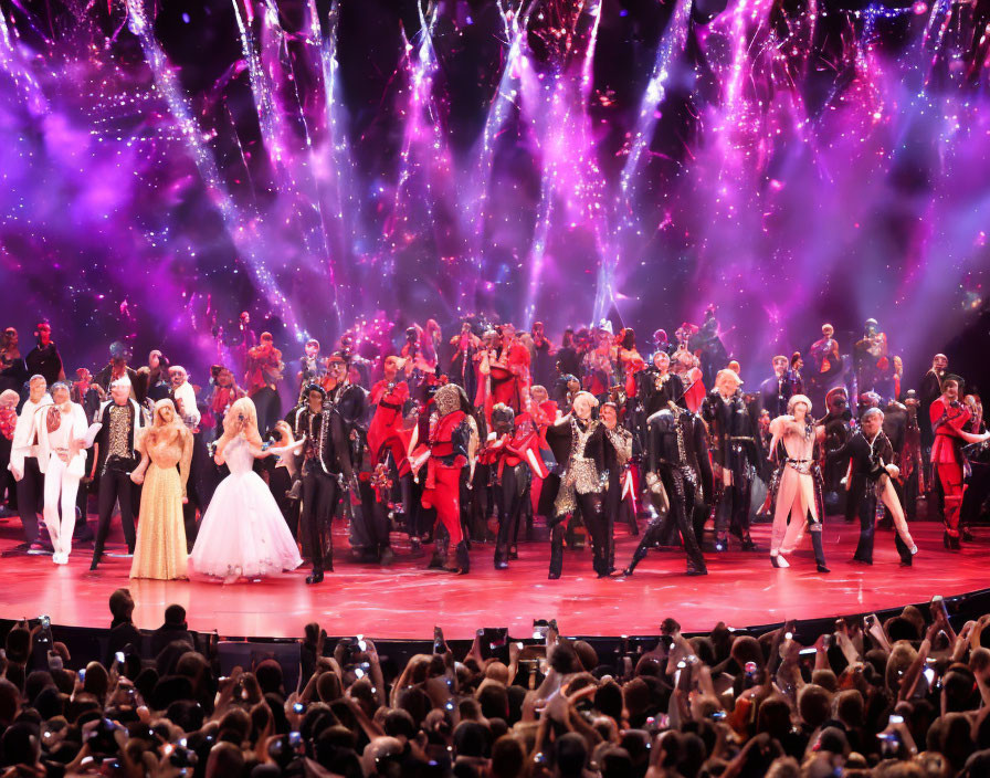 Colorful concert scene with performers, dancers, and audience amid purple lights