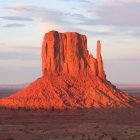 Striated rock formations in surreal desert landscape