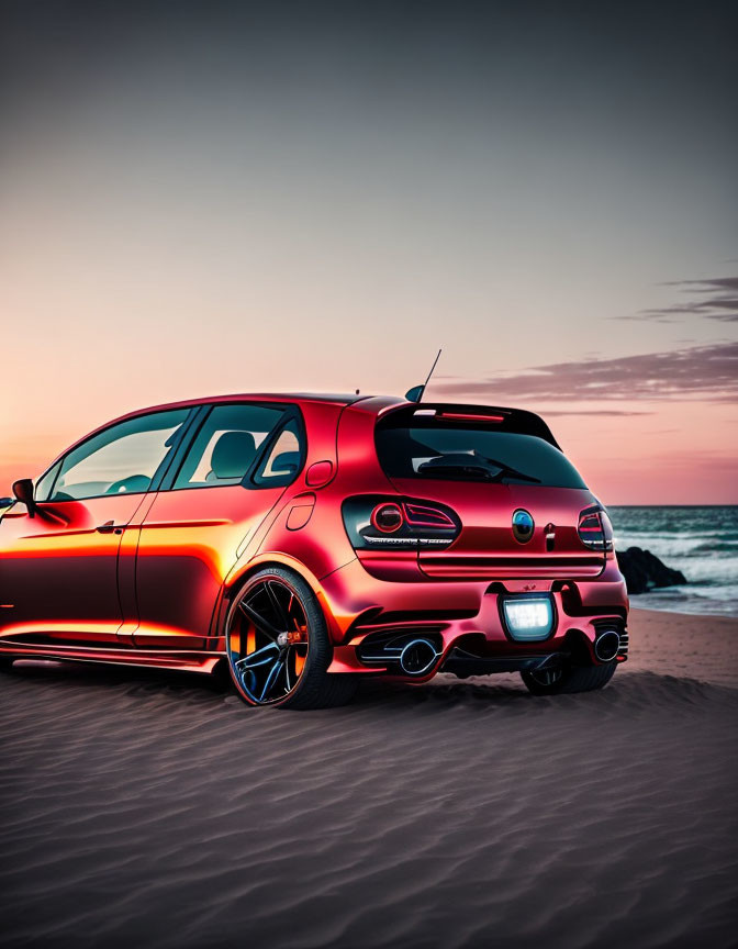 Red Car Parked on Sandy Beach at Colorful Sunset