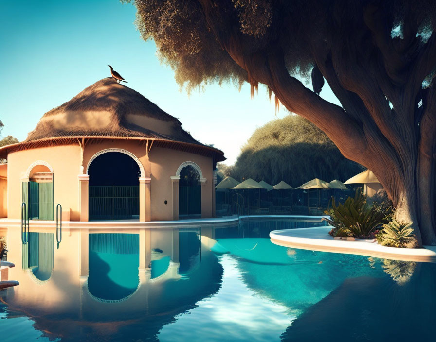 Tranquil poolside scene with round thatched-roof building and lush trees at dusk