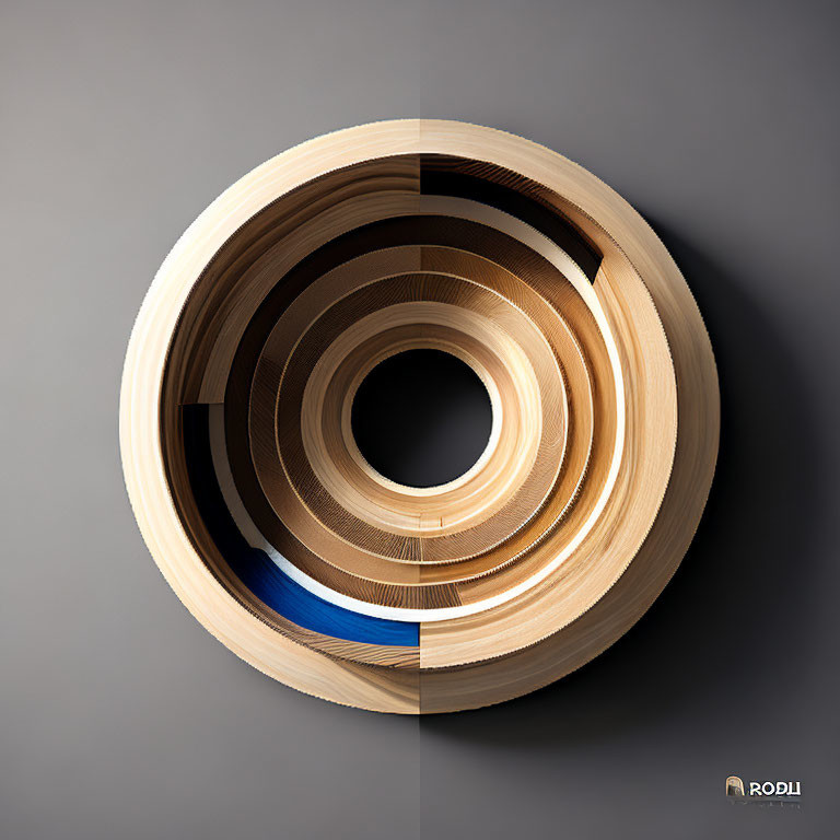 Abstract circular artwork with layered paper creating a spiral effect in neutral tones and a hint of blue, signed